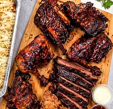 Platter for 2 with ribs, chicken, sliced smoked beef, fried chicken and fries
